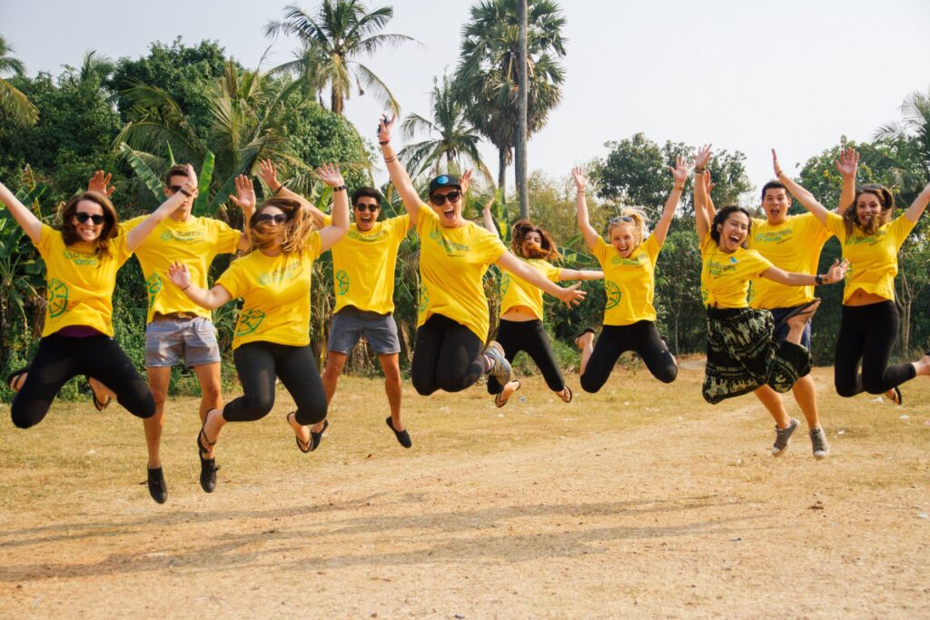 A group of students jumping in the air smiling